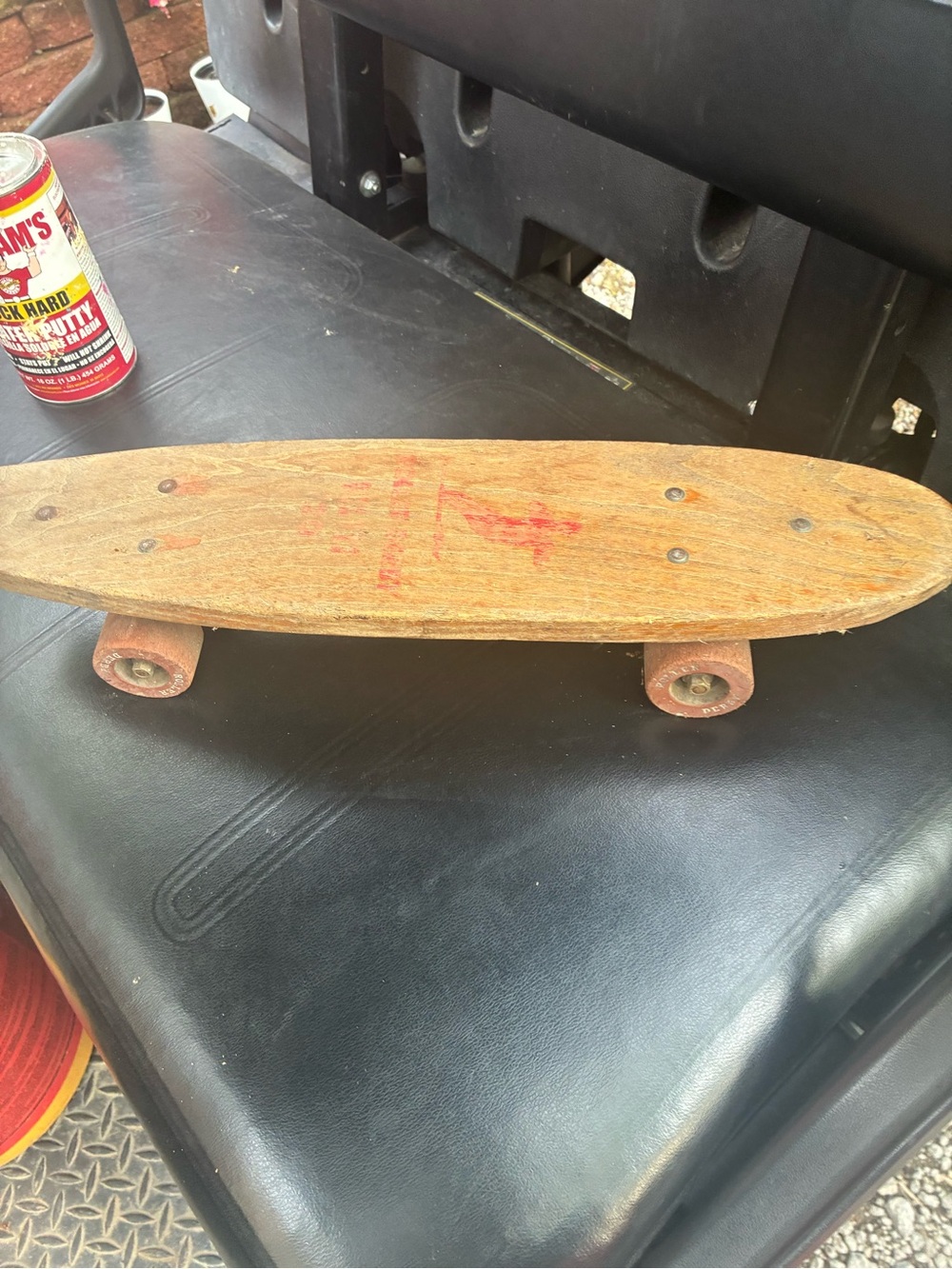 Vintage Wooden Skateboard with Red Graphic